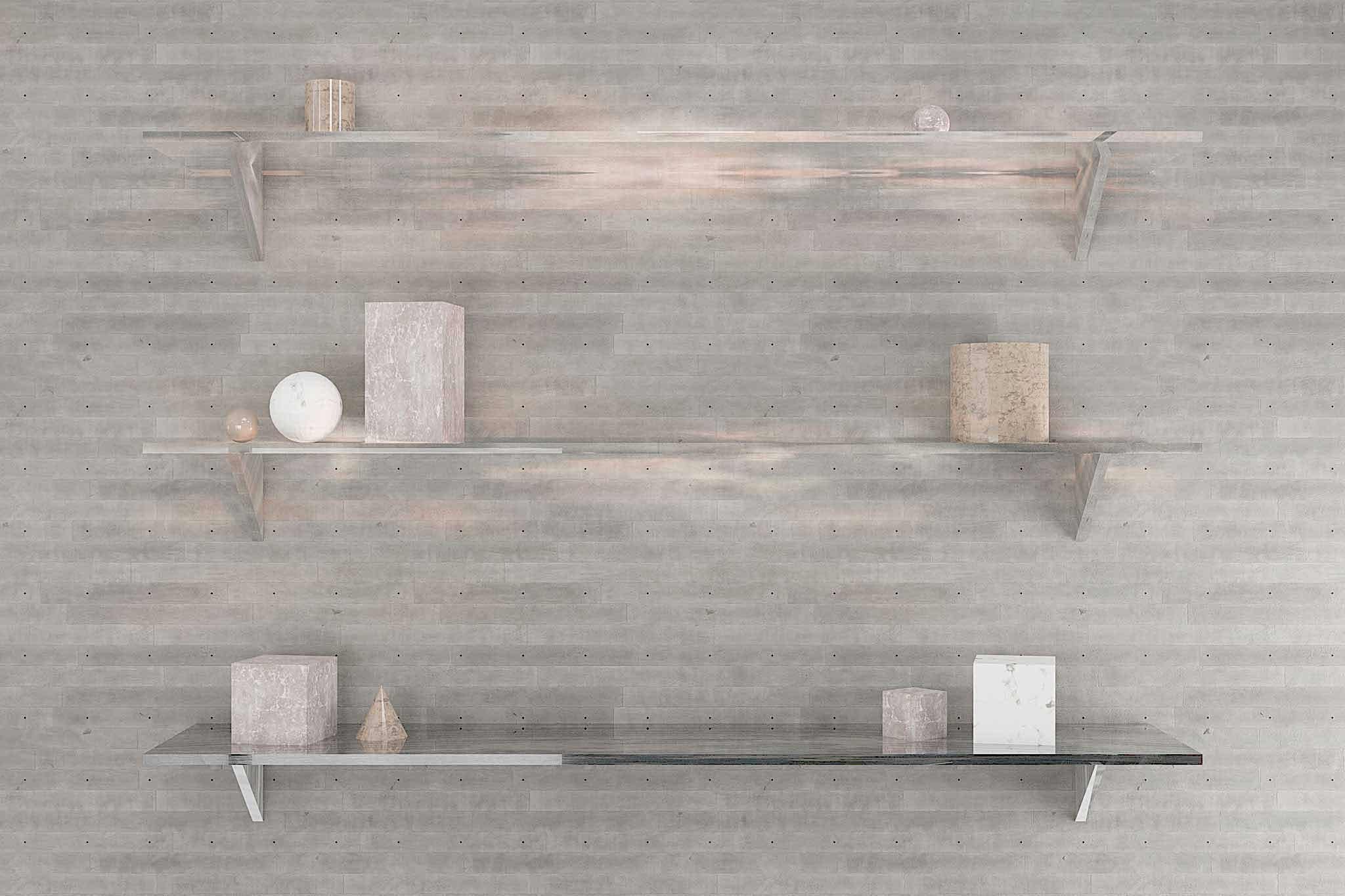 Three glass shelves on the wall with concrete tiles and abstract geometric objects.
