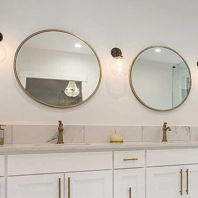 glass shower enclosure and door, plus two round mirrors